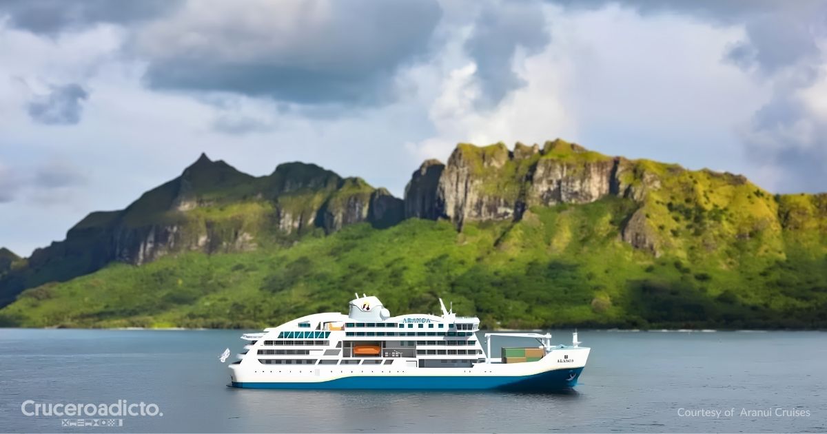 Recreación del Aranoa de Aranui Cruises, con contenedores de carga en la cubierta de proa, navegando frente a una isla montañosa de la Polinesia. Cortesía de Aranui Cruises.